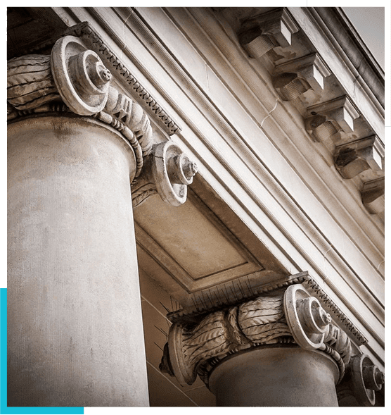 A close up of the pillars on an old building