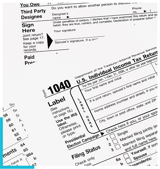 A close up of several different tax forms.