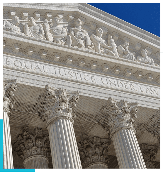 A close up of the front of a building with columns