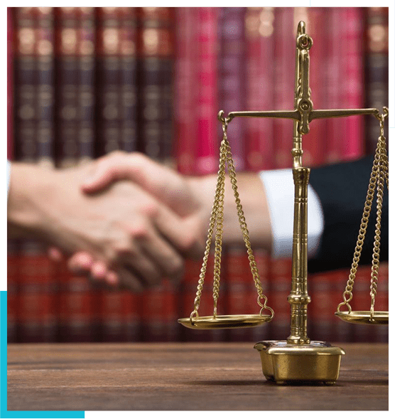 A judge 's gavel and scale on top of a table.